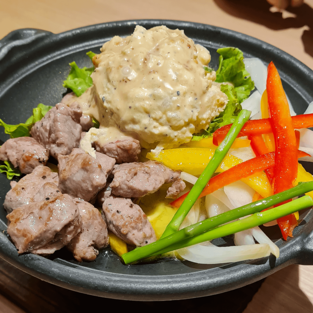 Tokusen Gyu Saikoro Steak with salad potato and capsicum
