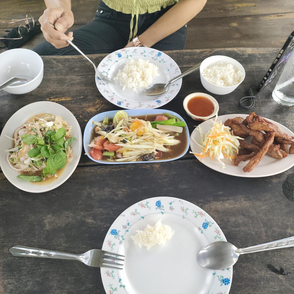 lunch at the local chicken restaurant. on the road to town in thailand
