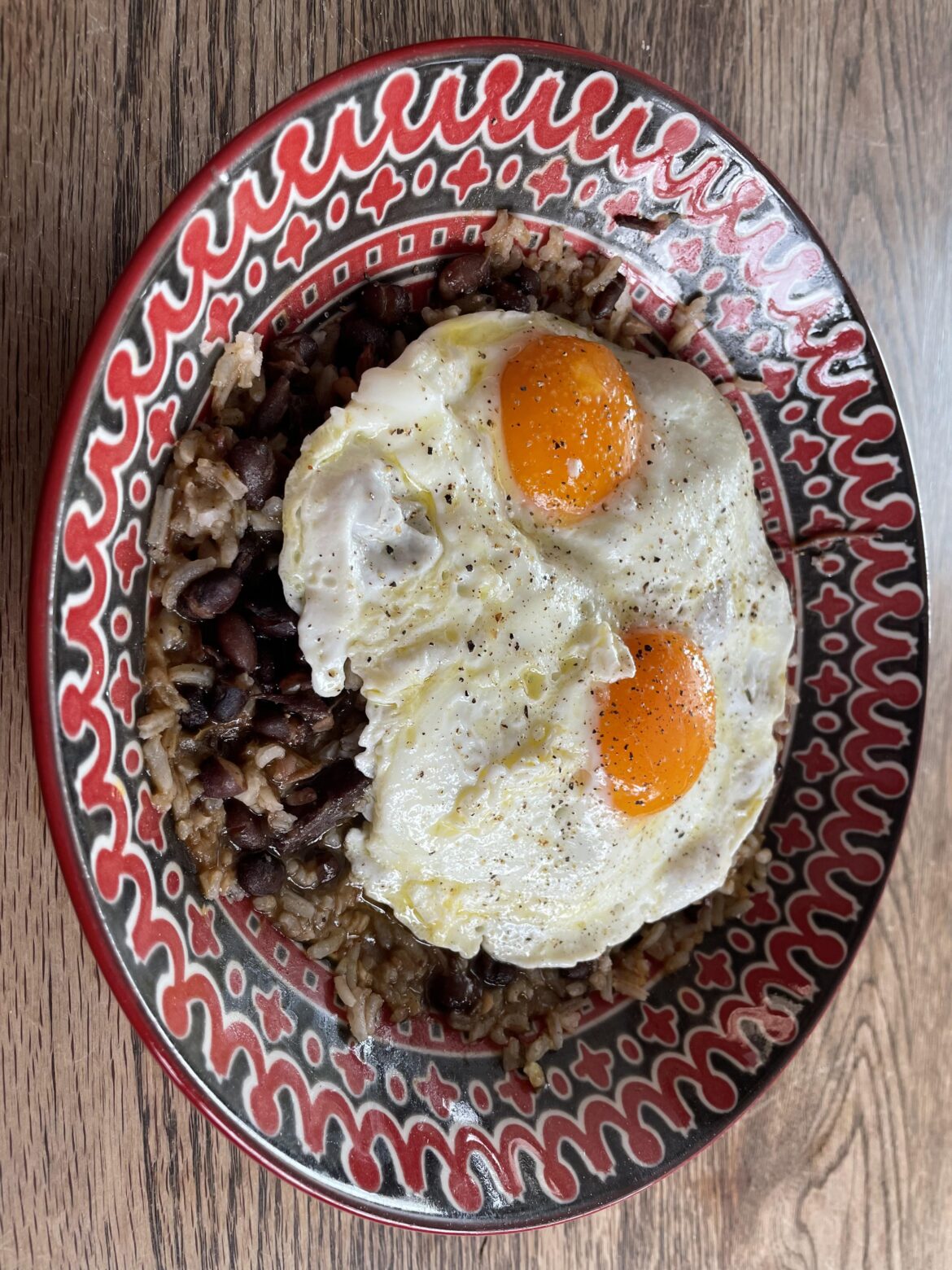 Brazilian Feijuada with sunny eggs