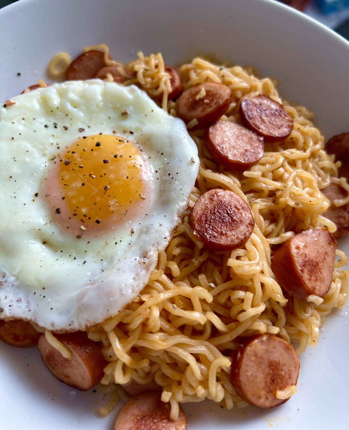 My go-to for a quick fix. Instant noodles with fried hotdogs topped with a crispy fried egg.