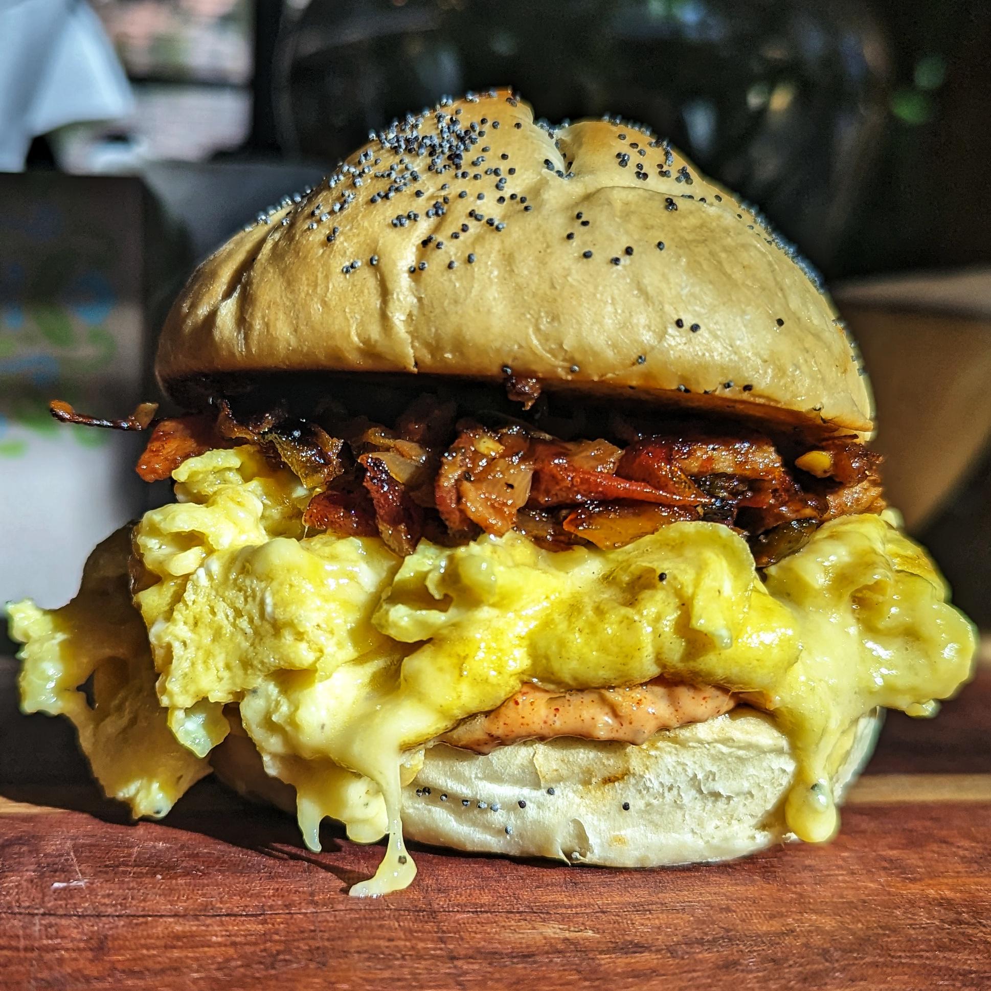 Breakfast sandwich fresh kaiser roll, egg, truffle Gouda, hickory