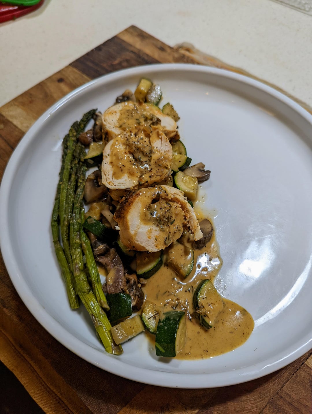 chicken roulade with duxelle, roasted fennel, asparagus, zucchini