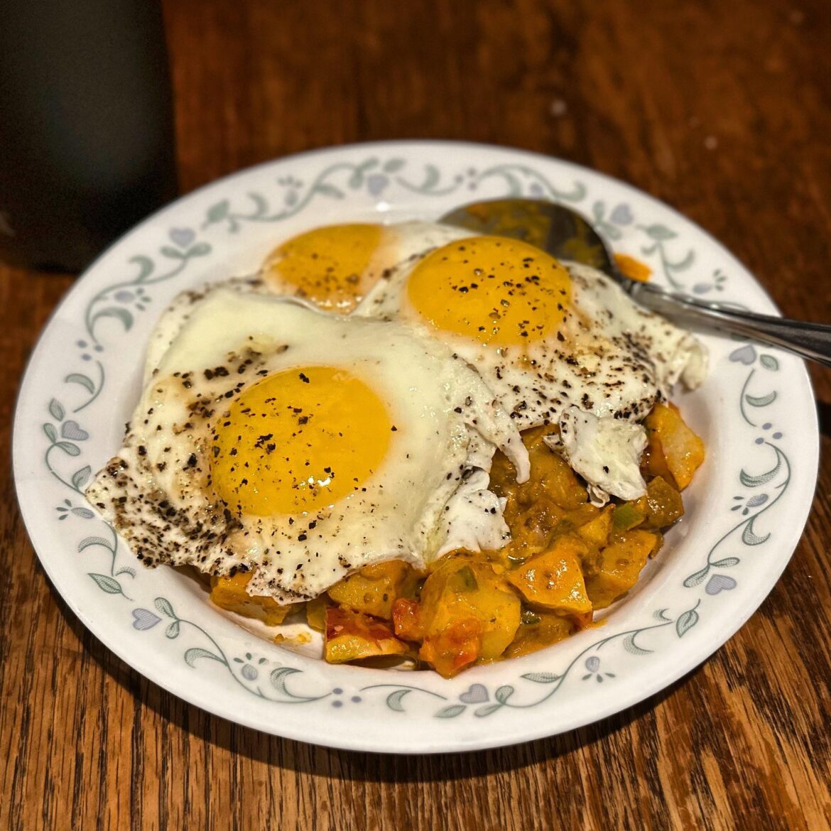 Three Sunny Side Up over Trader Joe’s Loaded Potatoes