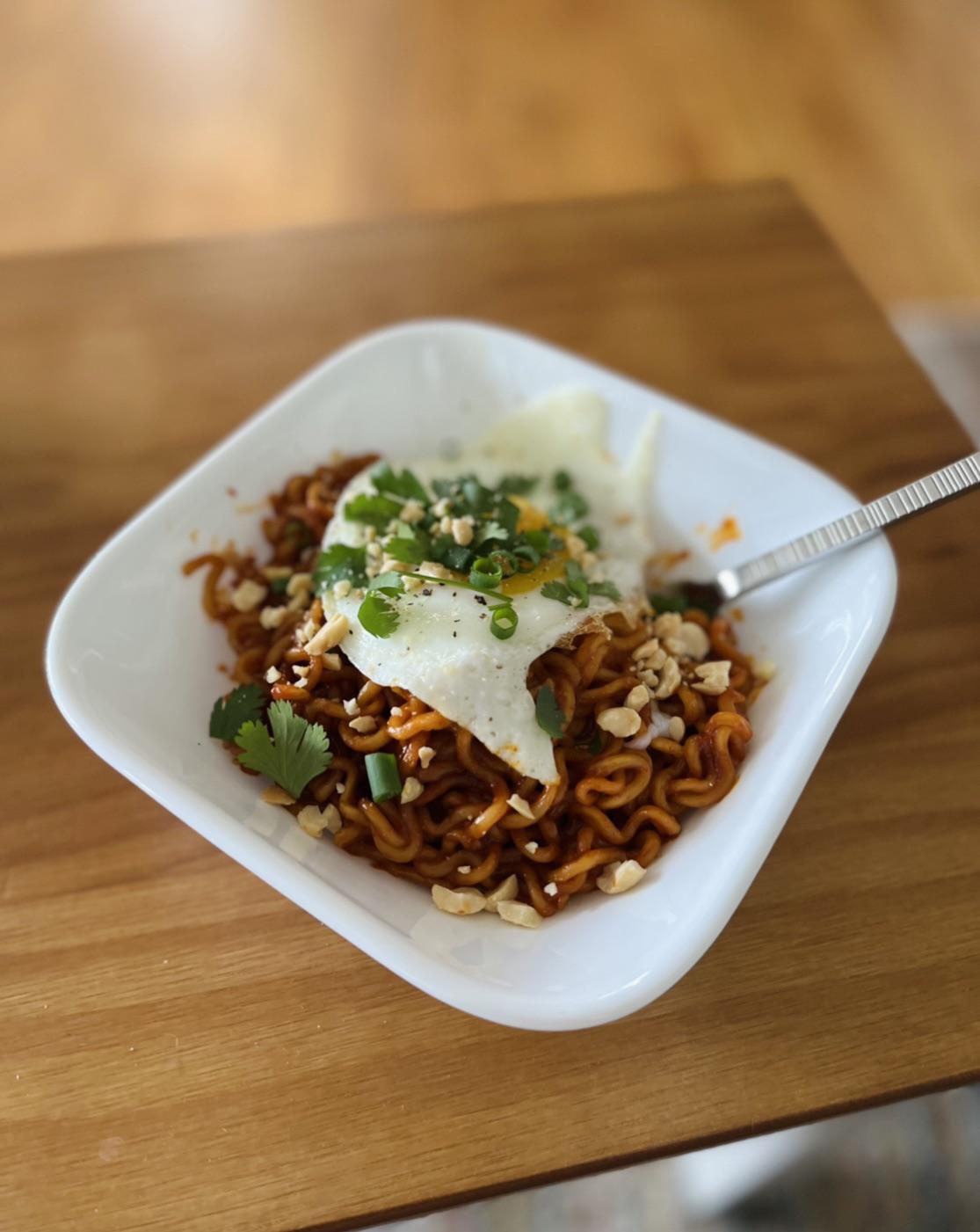 Buldak Samyang spicy chicken with peanut butter, cilantro, green onion