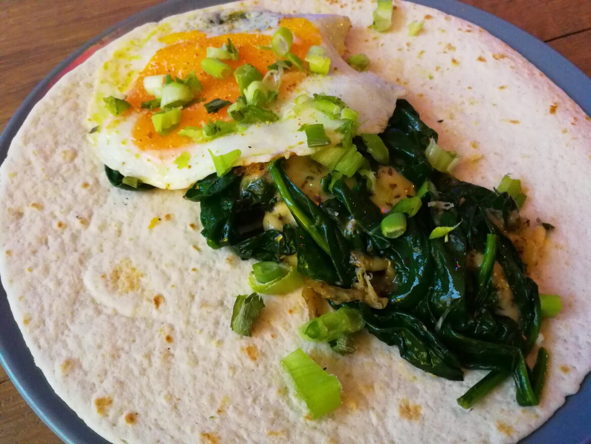Spinach, molten cheese, spring onions with Italian herbs are best tasting between a wrap and an egg
