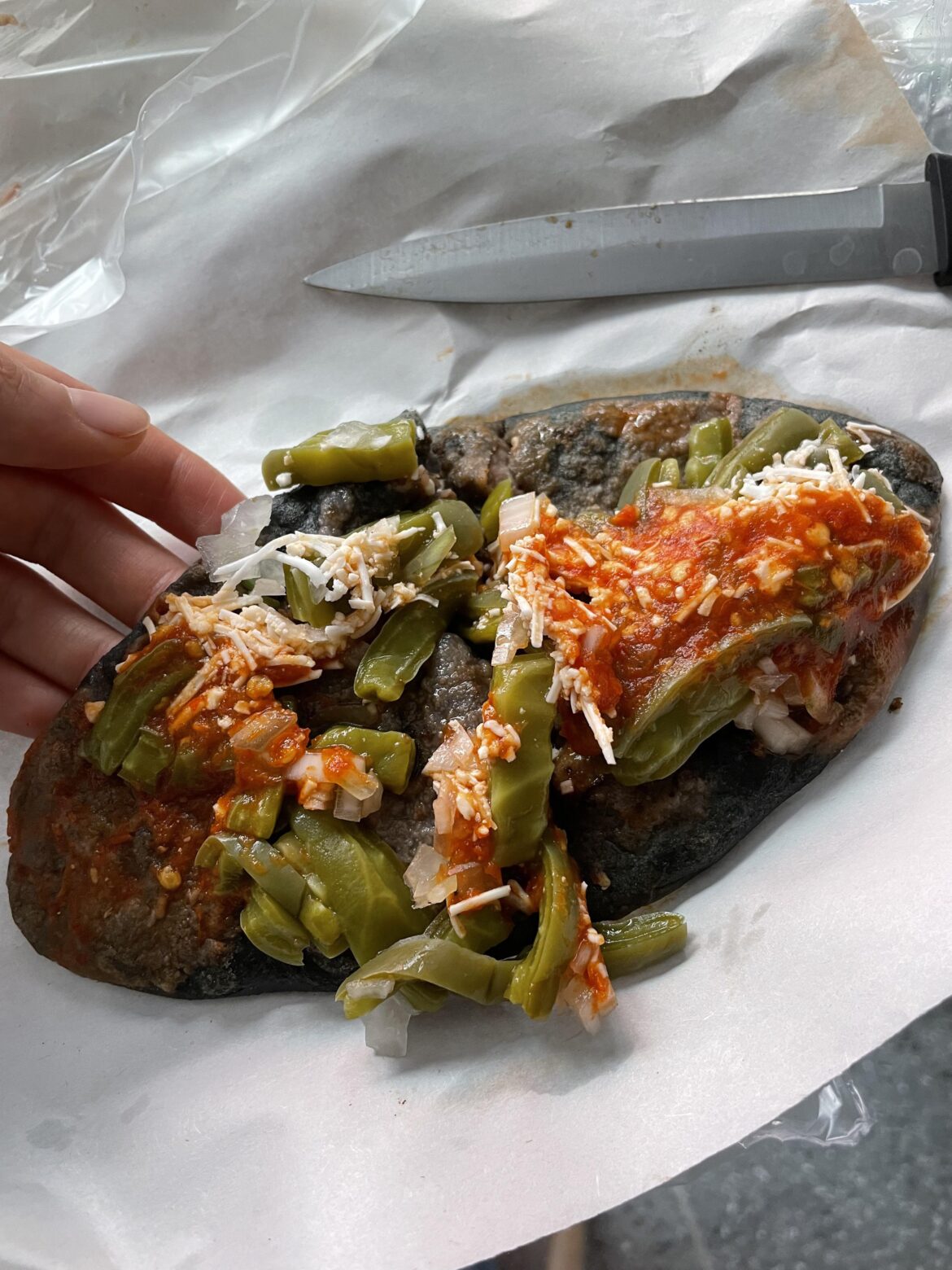 Tlacoyo with blue corn masa in Mexico City