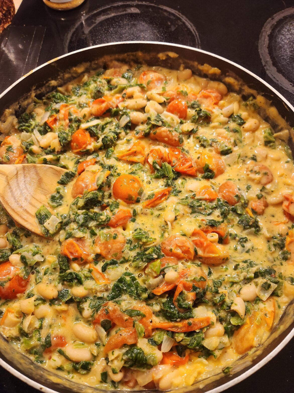 Beans, spinach, tomatoes, and cashew cream