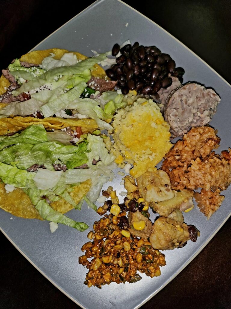Milanesa steak tacos and ALL the sides! Refried Beans, Black Beans, Mexican Rice, Mexican-style Potato Salad, Corn Salad, and Sweet Corn Cake.