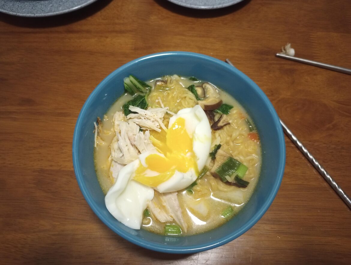 Grocery store ramen with steamed bok choy and bits of rotisserie chicken