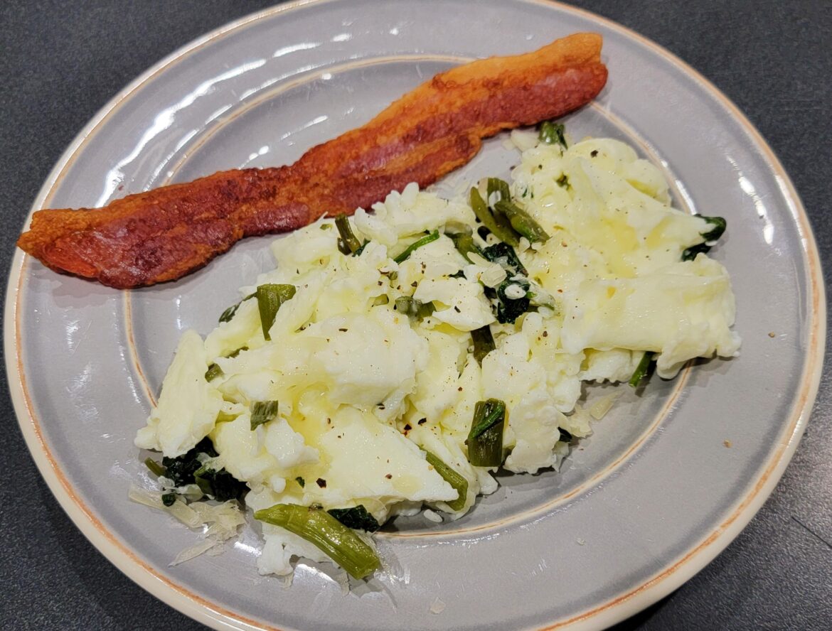 Cheesy egg white and spinach scramble with bacon (used 4 eggs; about 220 calories)