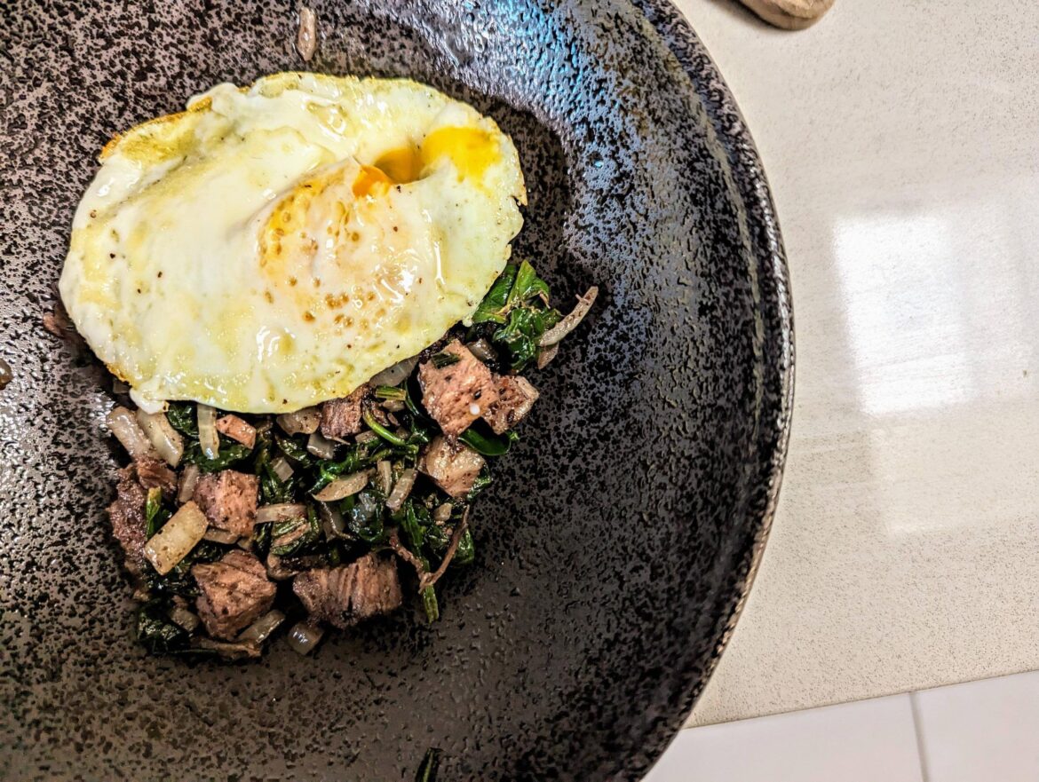 Sumac Braised Spinach and Onion with Smoked Brisket and Of Course, An Egg.