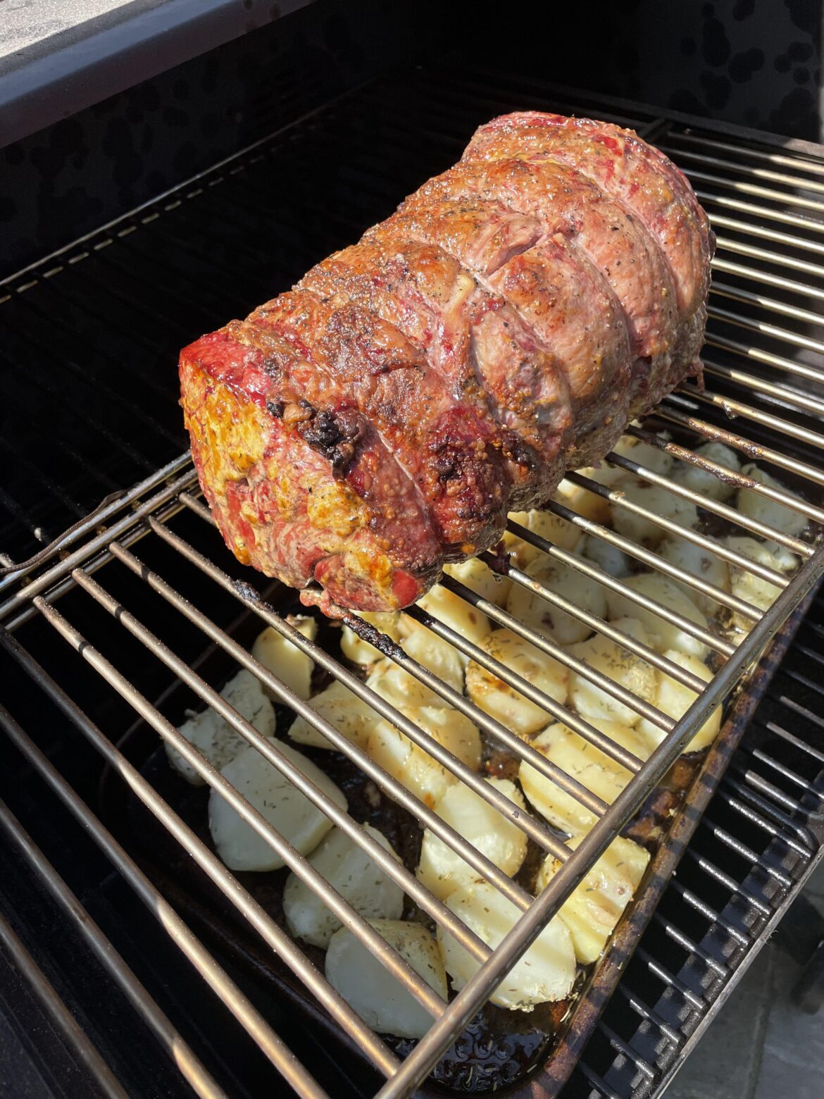 Roast British beef topside and (half done) beef dripping roast potatoes on Campchef woodwind 24