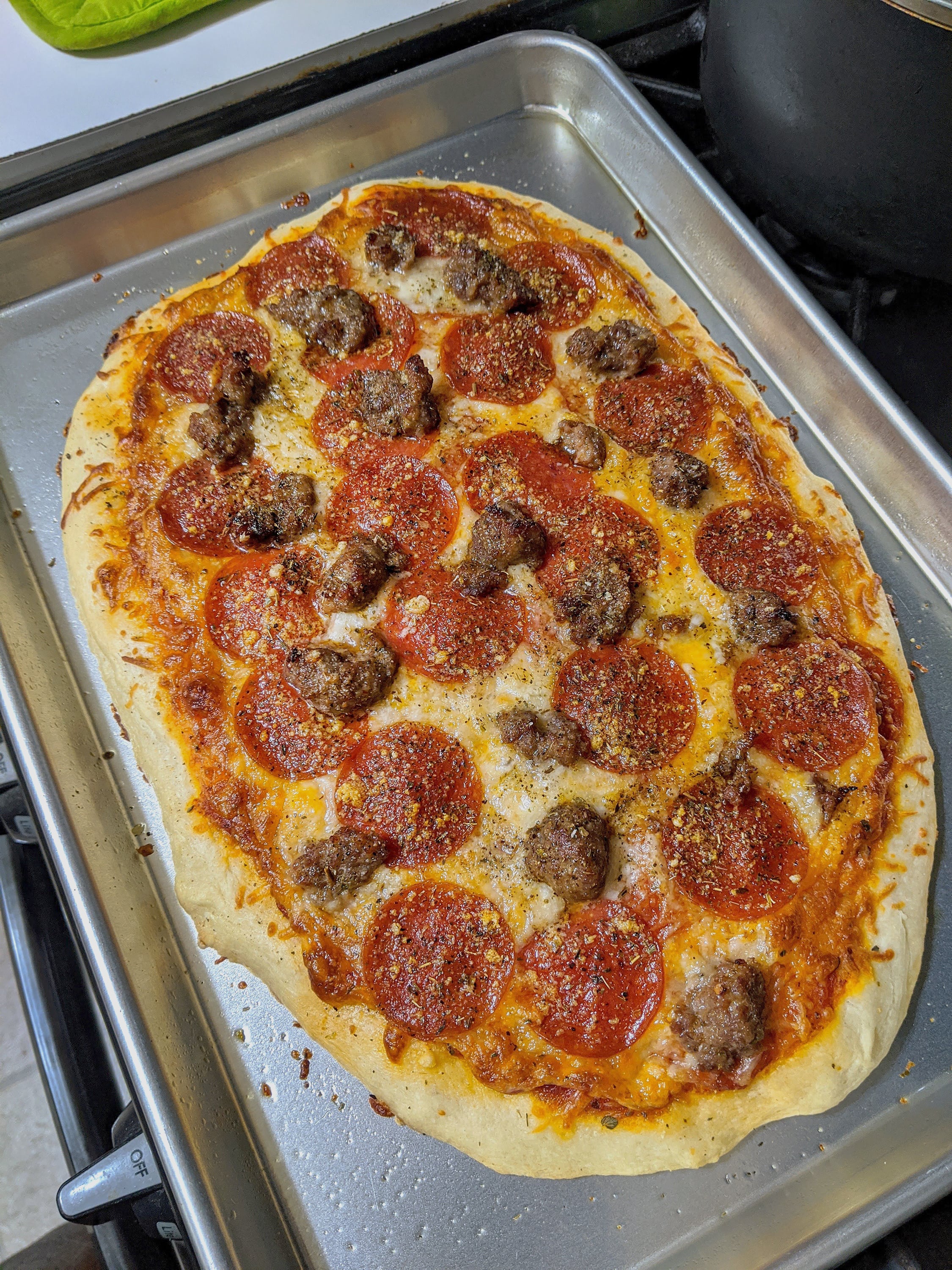 Greetings! I made this pizza. Pepperoni and Italian sausage. Dining