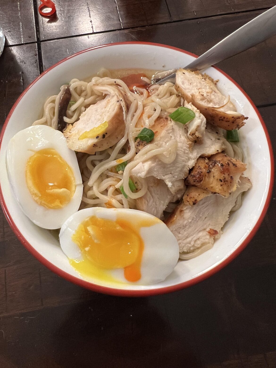 An egg over homemade chicken ramen