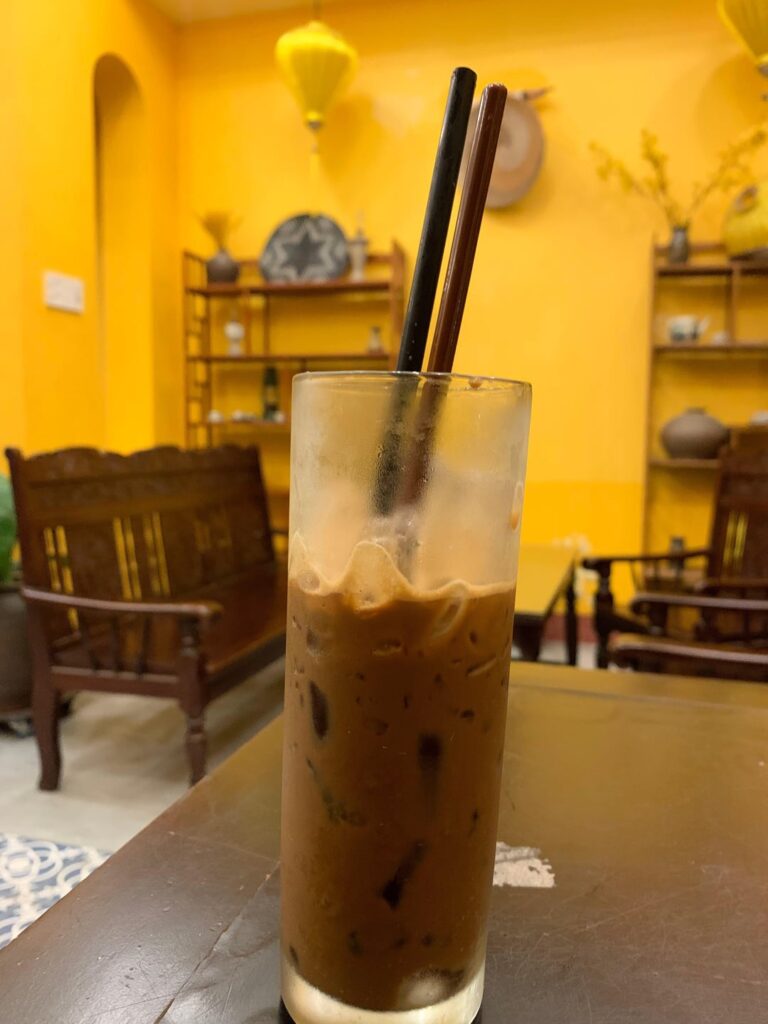 Sip on a coffee and enjoy the quiet calm on this cozy cafe in small town Vietnam