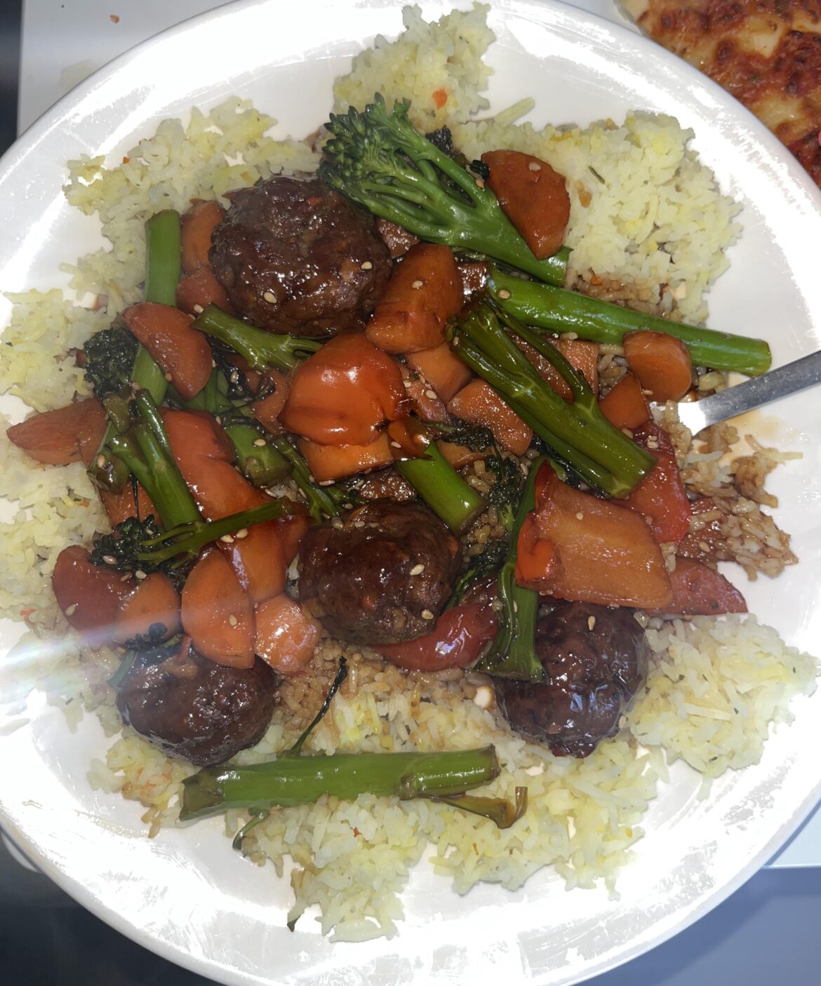 Teriyaki beef meatballs (and my sons pizza on the background 😁) it was so tasty. The rice is yellow because i used dried veg seasoning instead of plain salt. I would make this again. My partner had it without the veggies.