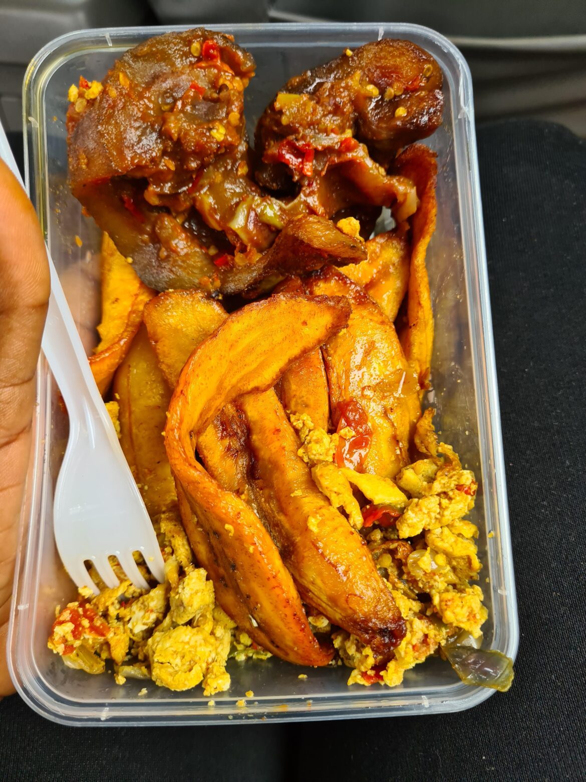 Cowhead, plantain and egg! (The spicy cowhead is the best part of the meal) - NIGERIA