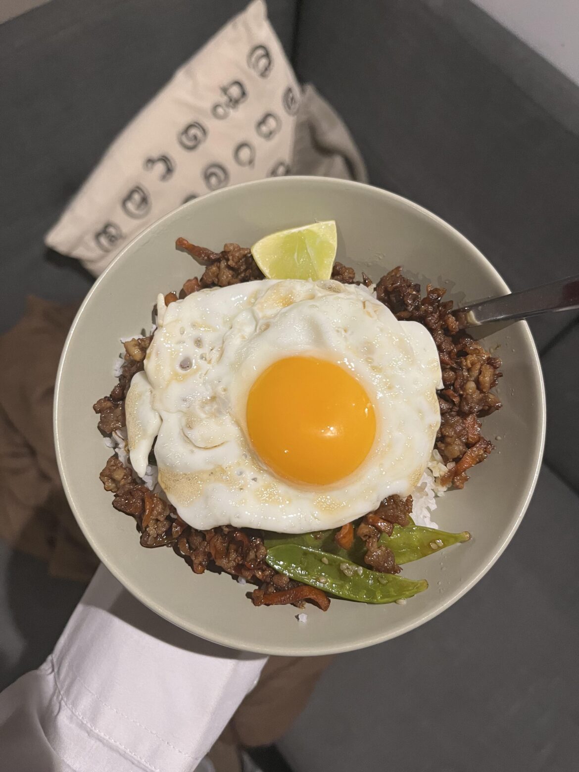 Simple fried egg on Vietnamese pork and mangetout