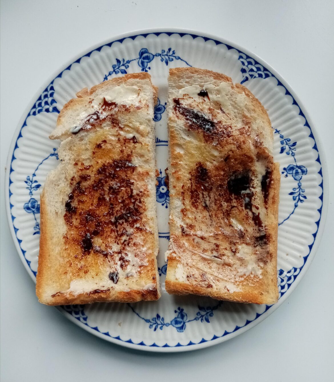 Crust of a loaf, toasted, slathered with butter and a hint of Marmite