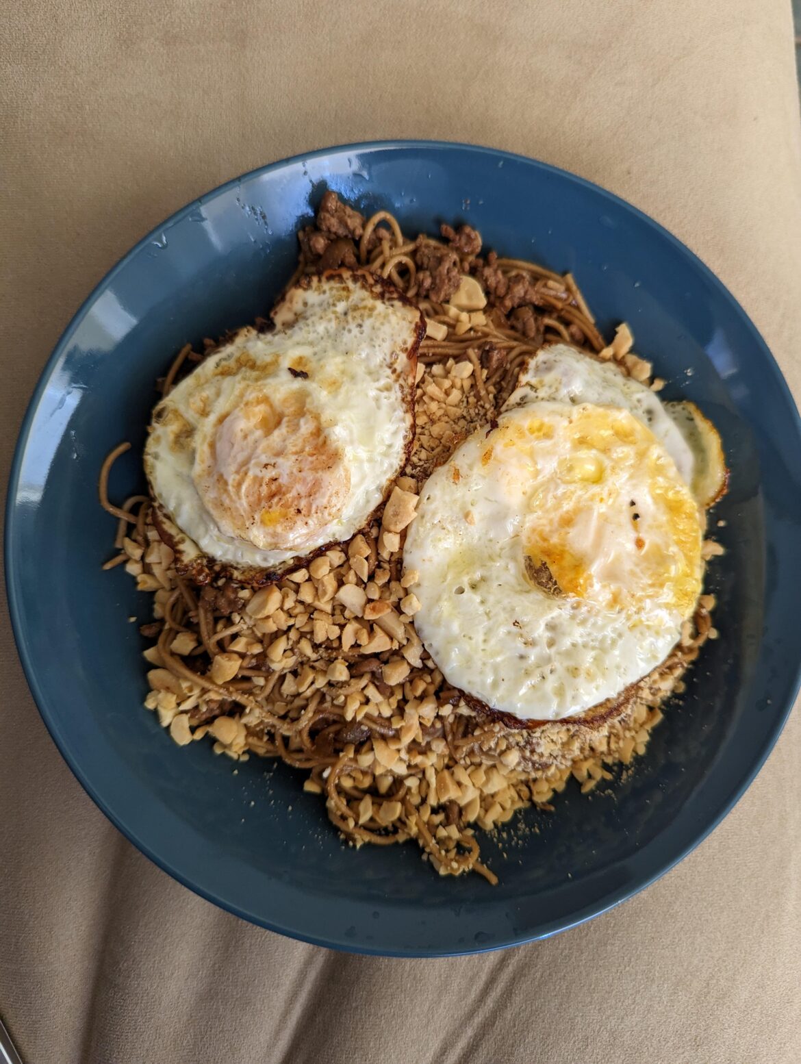 Peanut beef noodles with 2 fried eggs
