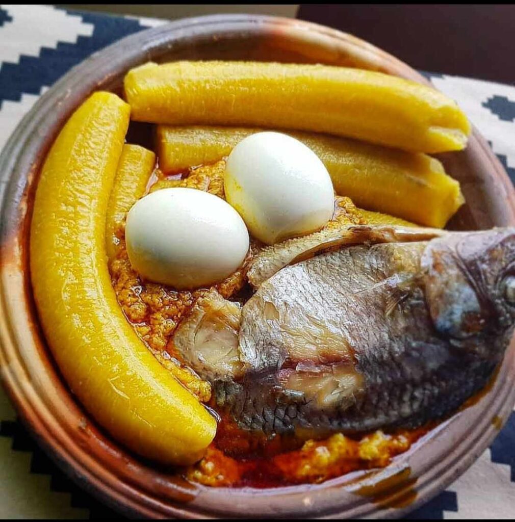 Boiled plantain, garden egg stew, boiled eggs and dried tilapia ~ Lapaz, Ghana