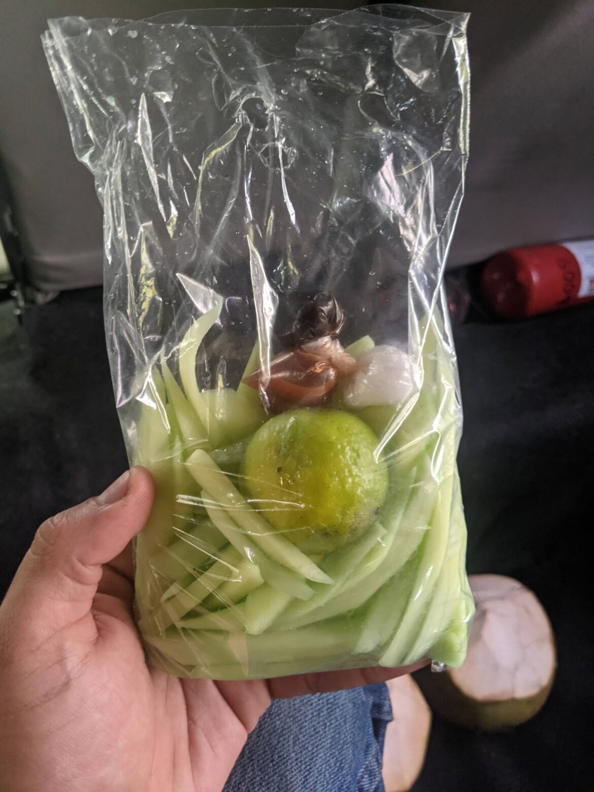 Green mango with lime, salt, and hot sauce in El Salvador! My mouth is watering again just looking at it!