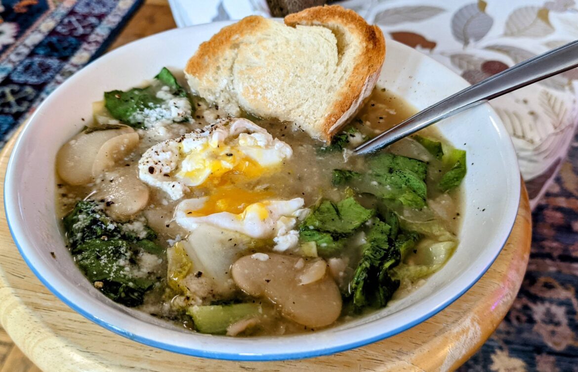 Italian white bean and escarole soup with poached egg