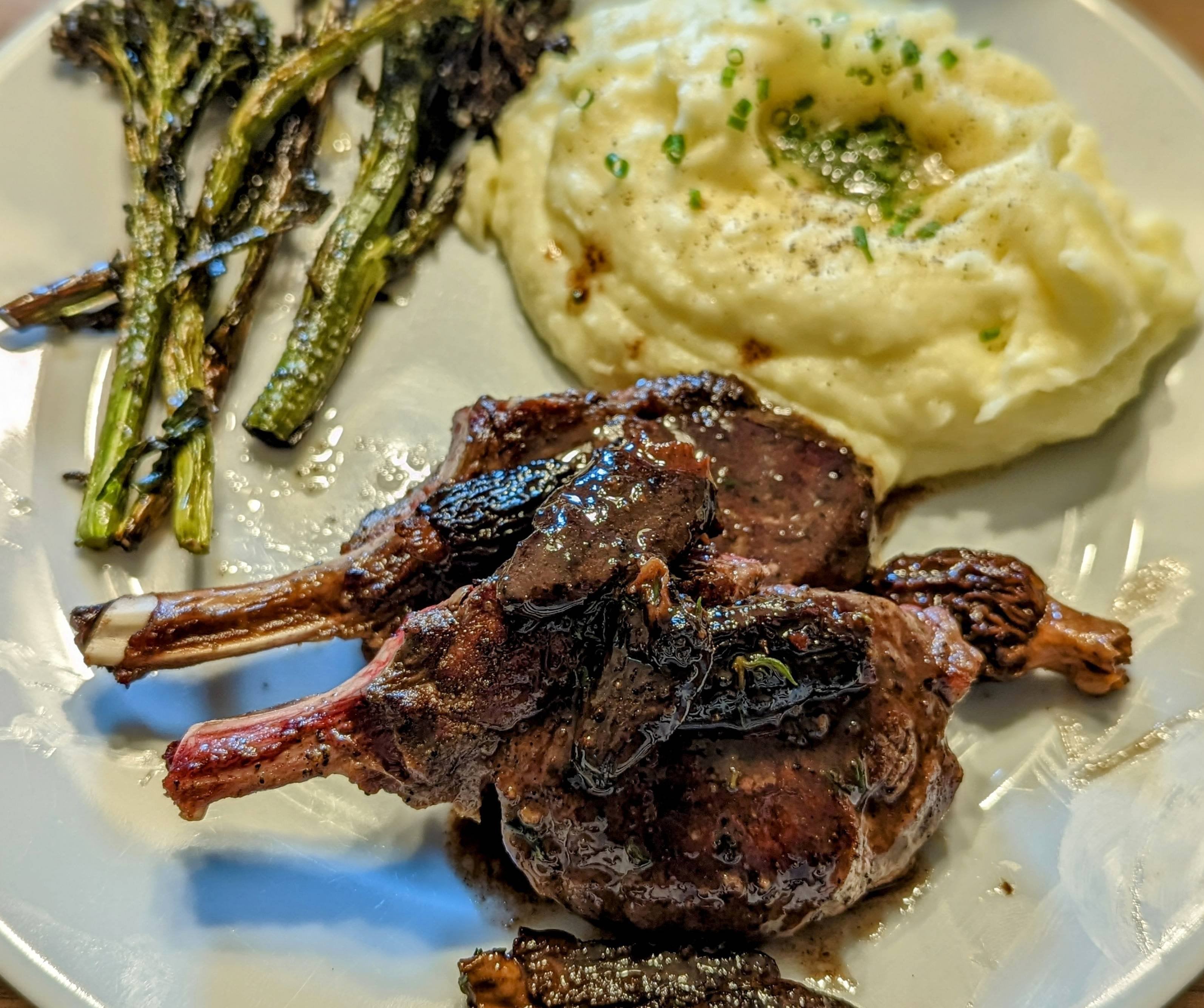 Venison chops with morel and black truffle sauce, mashed Yukon golds, broccolini Dining and