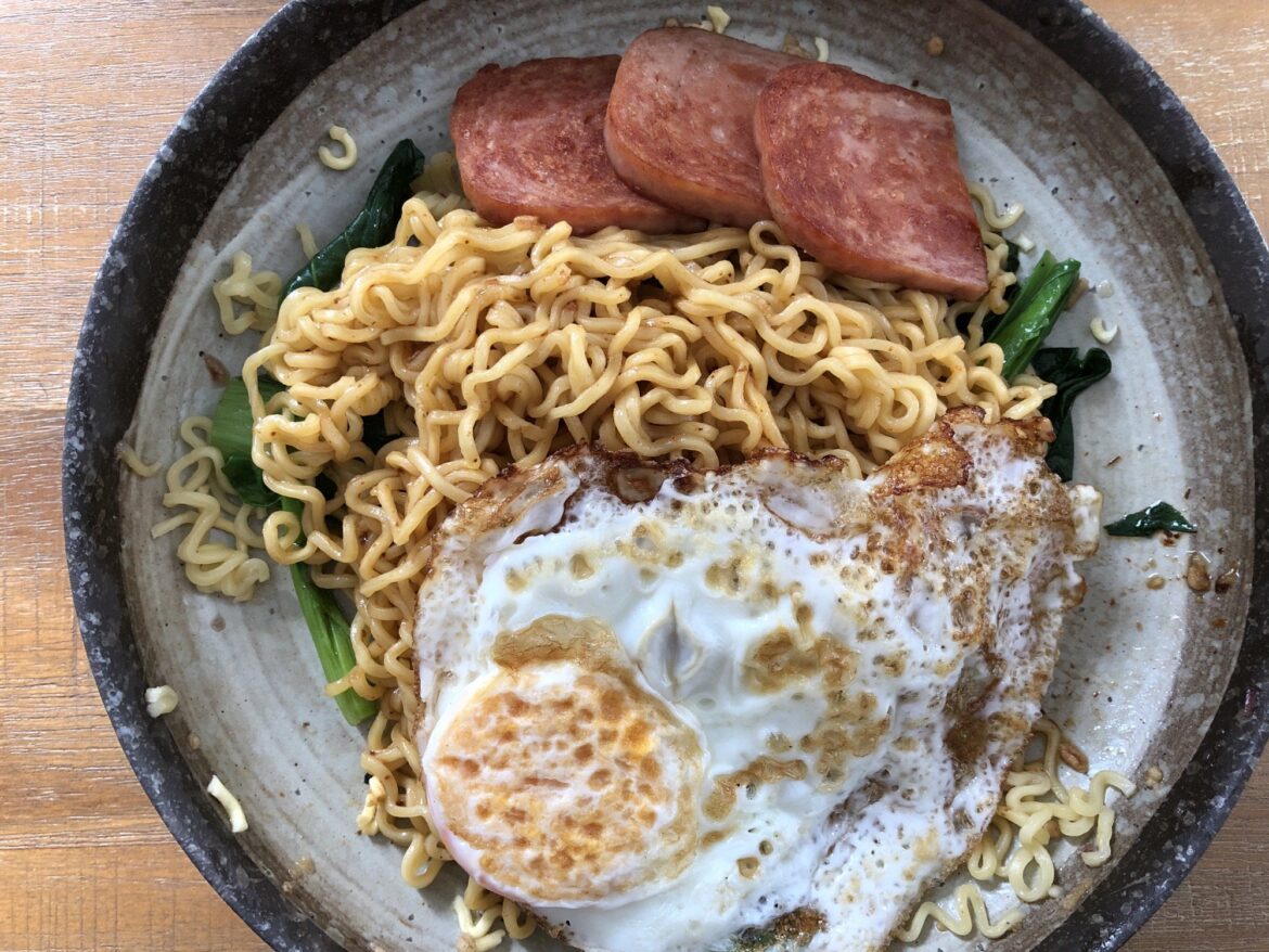 Fried egg on mie goreng with spam