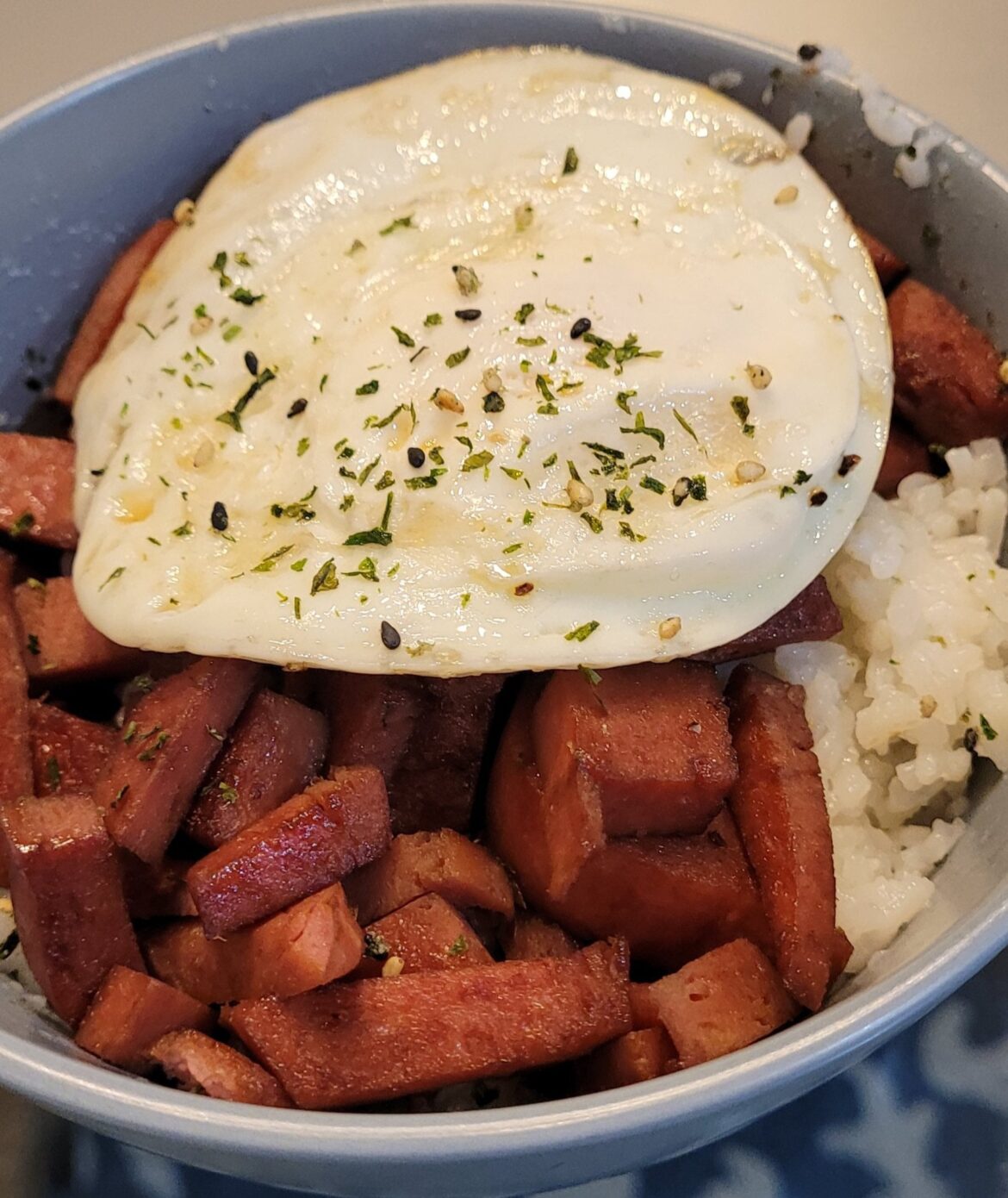 Tried to make rice balls. They fell apart, so I threw it in a bowl and did the thing.
