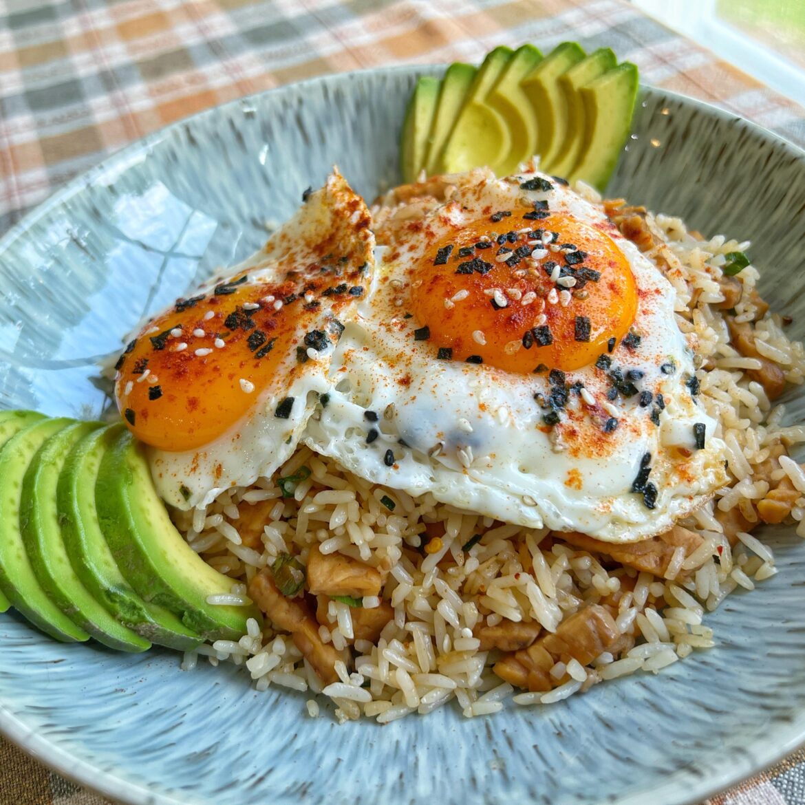 Fried rice with tempeh bacon for breakfast; avocado and some farm fresh eggies on top