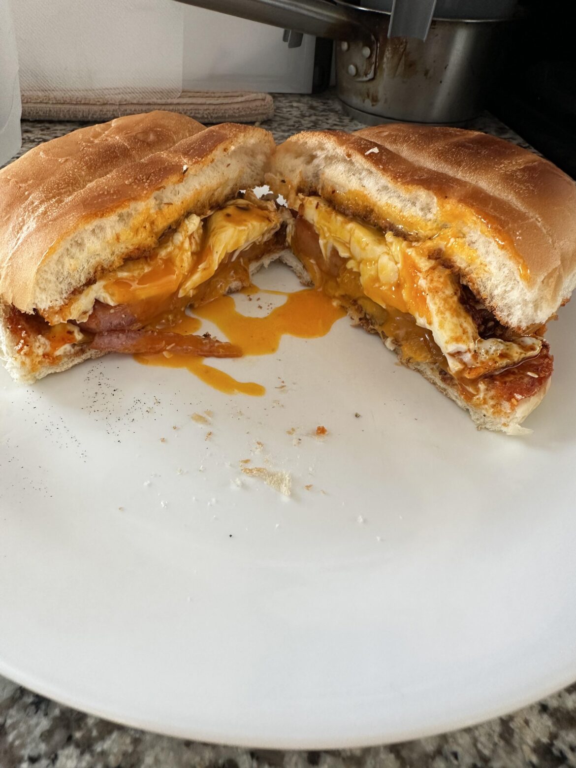 Spam, Egg, and Cheese on a roll with kewpie and chili crunch.