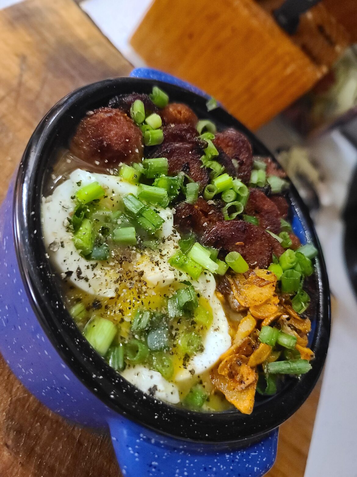 Chouriço Ramen, fried garlic, homemade garlic/ginger/tumeric broth, 5 minute egg