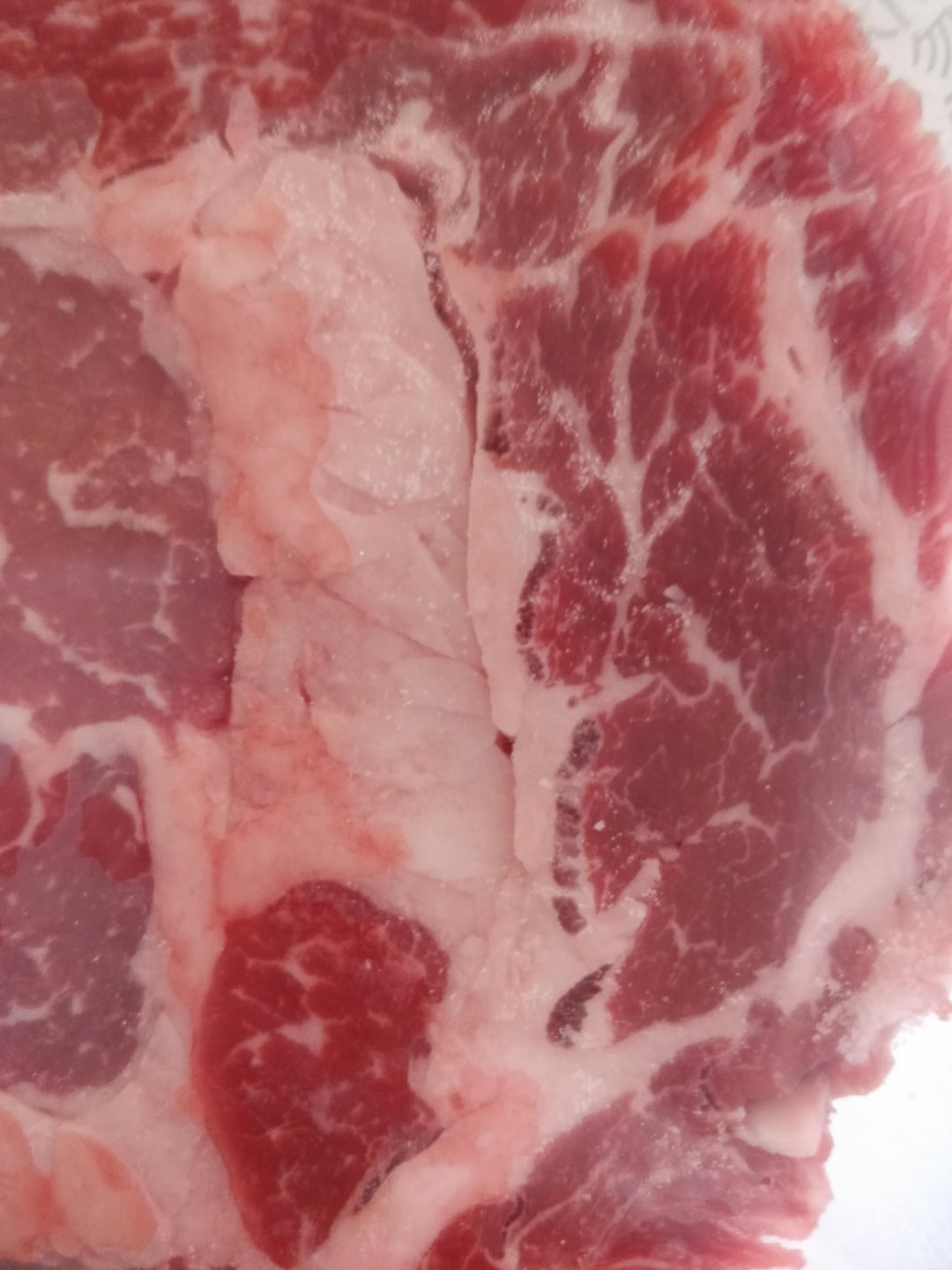Just noticed these dark lines on these Ribeyes. Never seen them on past