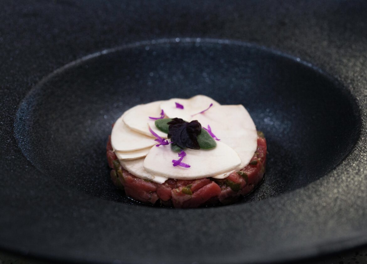 Beef Tartare with mushroom emulsion, spruce oil chives and lingonberries