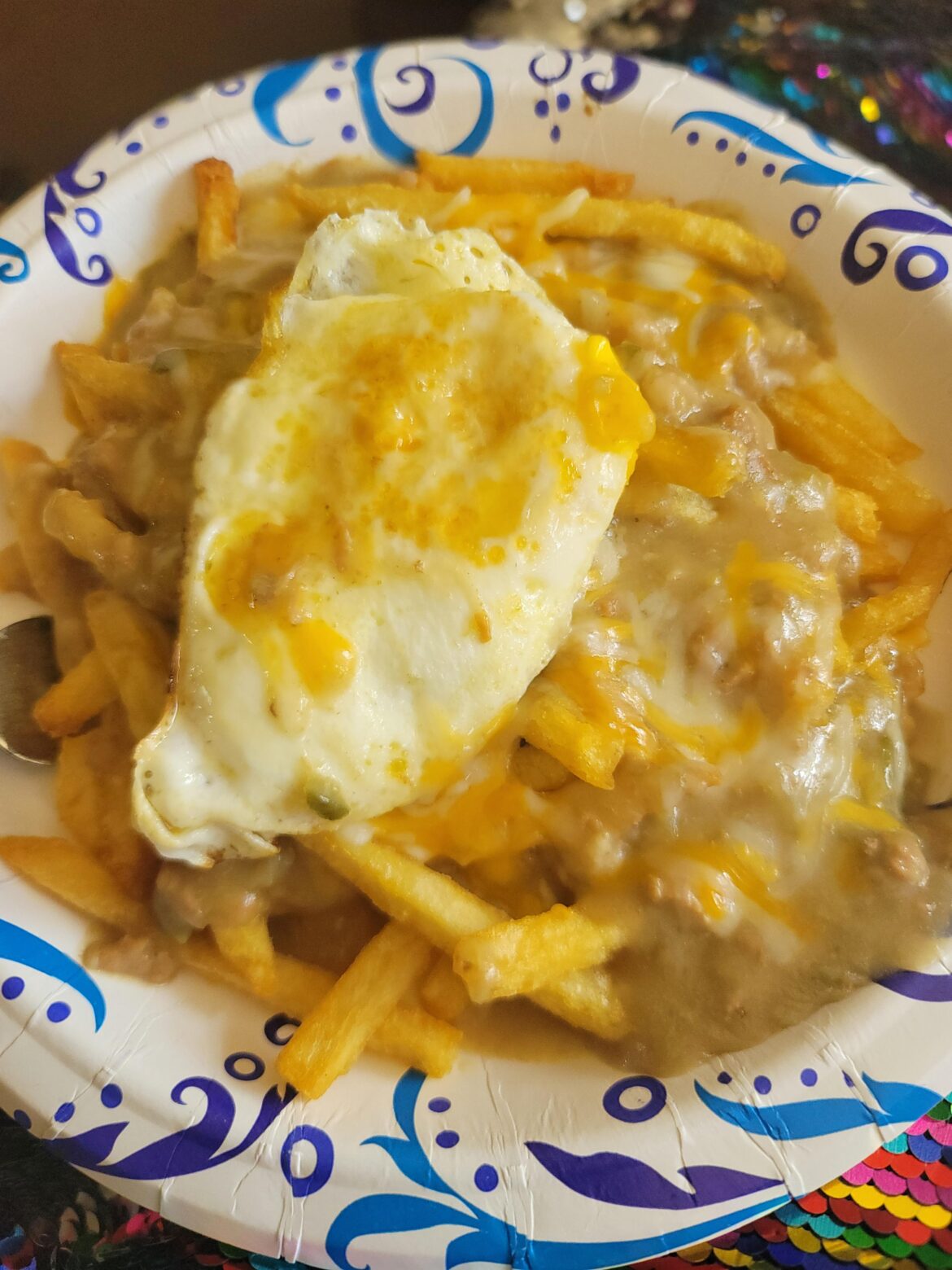 Green chile fries with a fried egg.