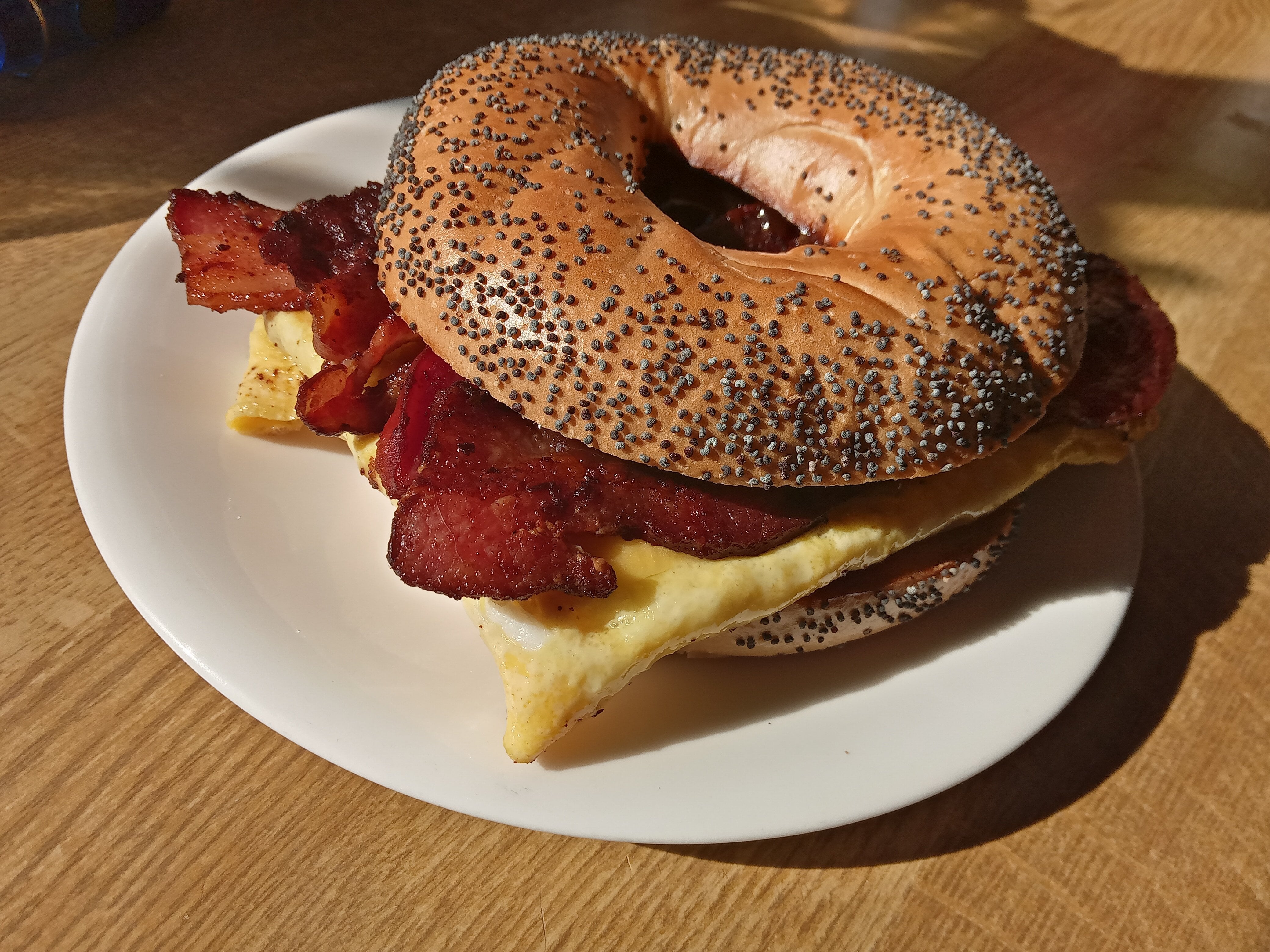 Bacon Egg and Cheese on Toasted PoppySeed Bagel Dining and Cooking