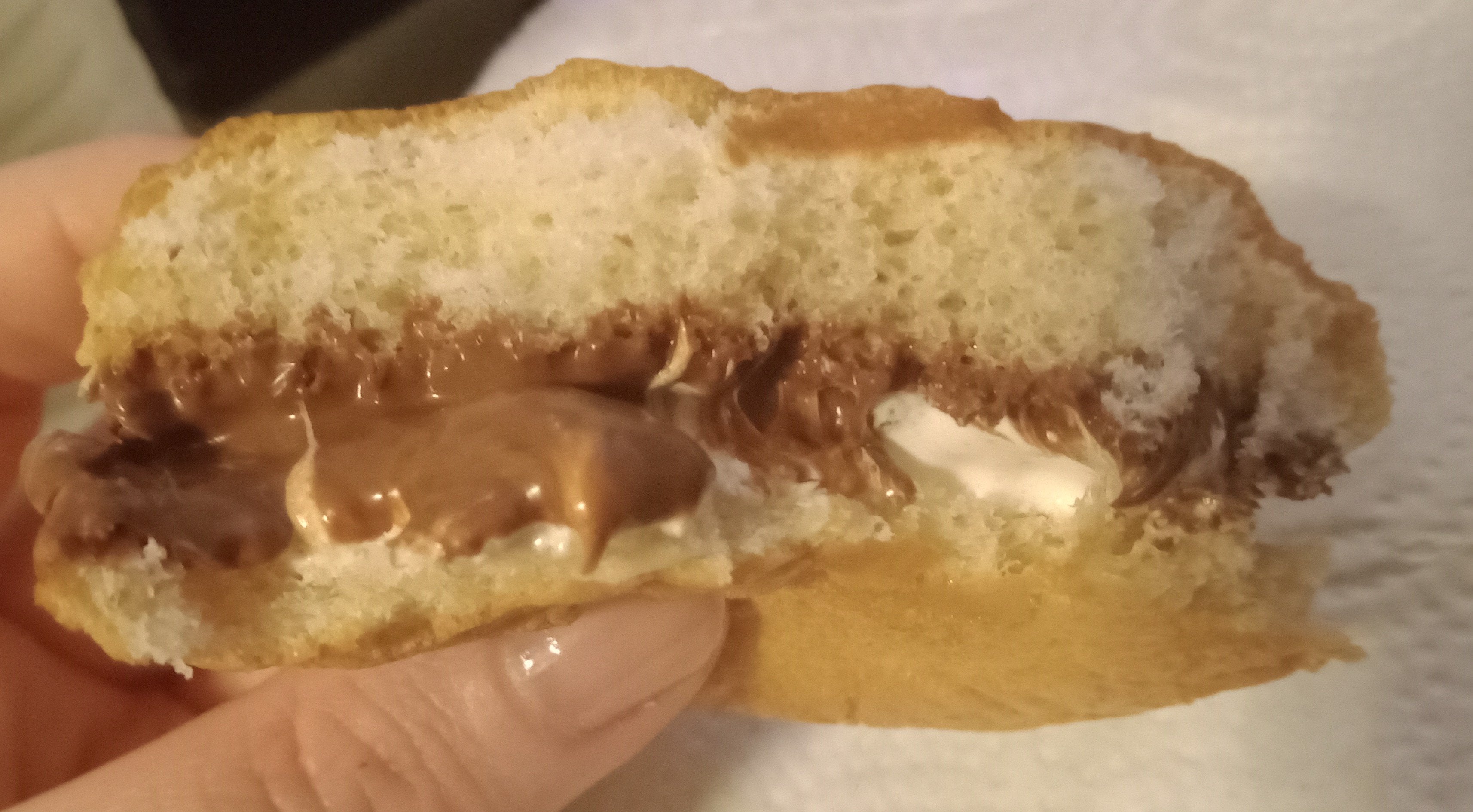 Nutella & marshmallow fluff on a hamburger bun, warmed in the microwave