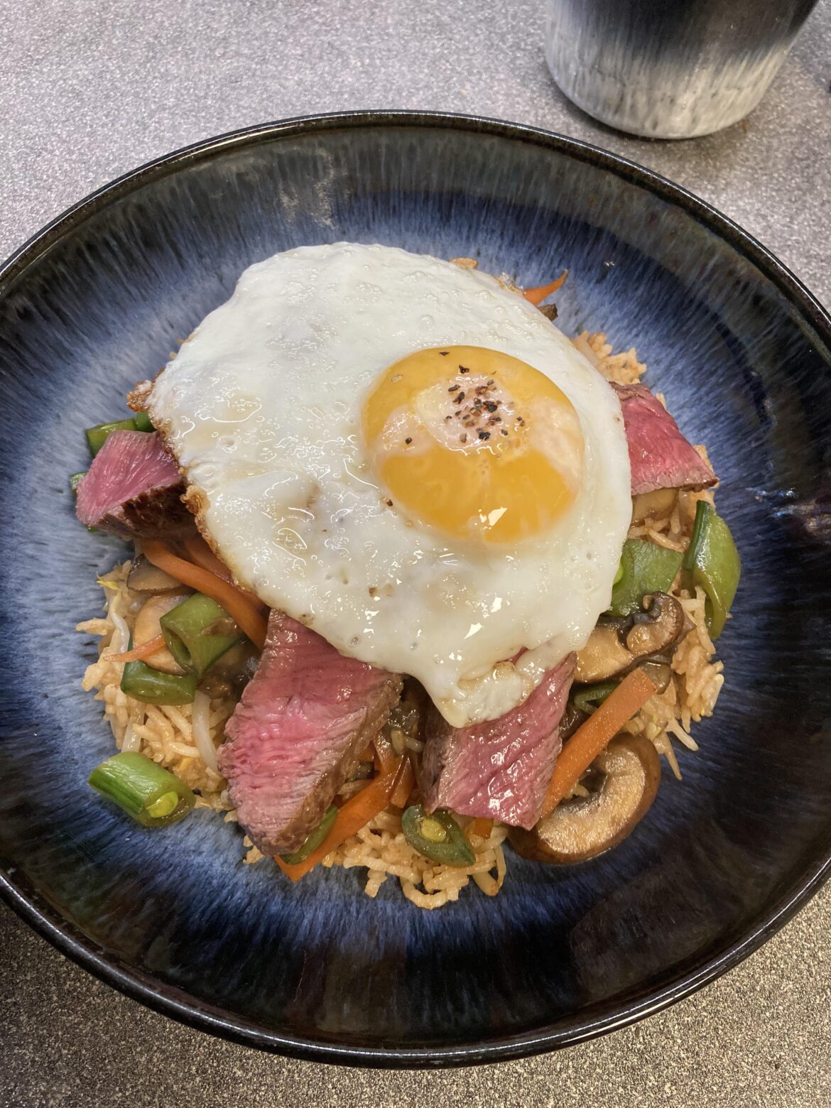 fried rice, steak, and of course, an egg
