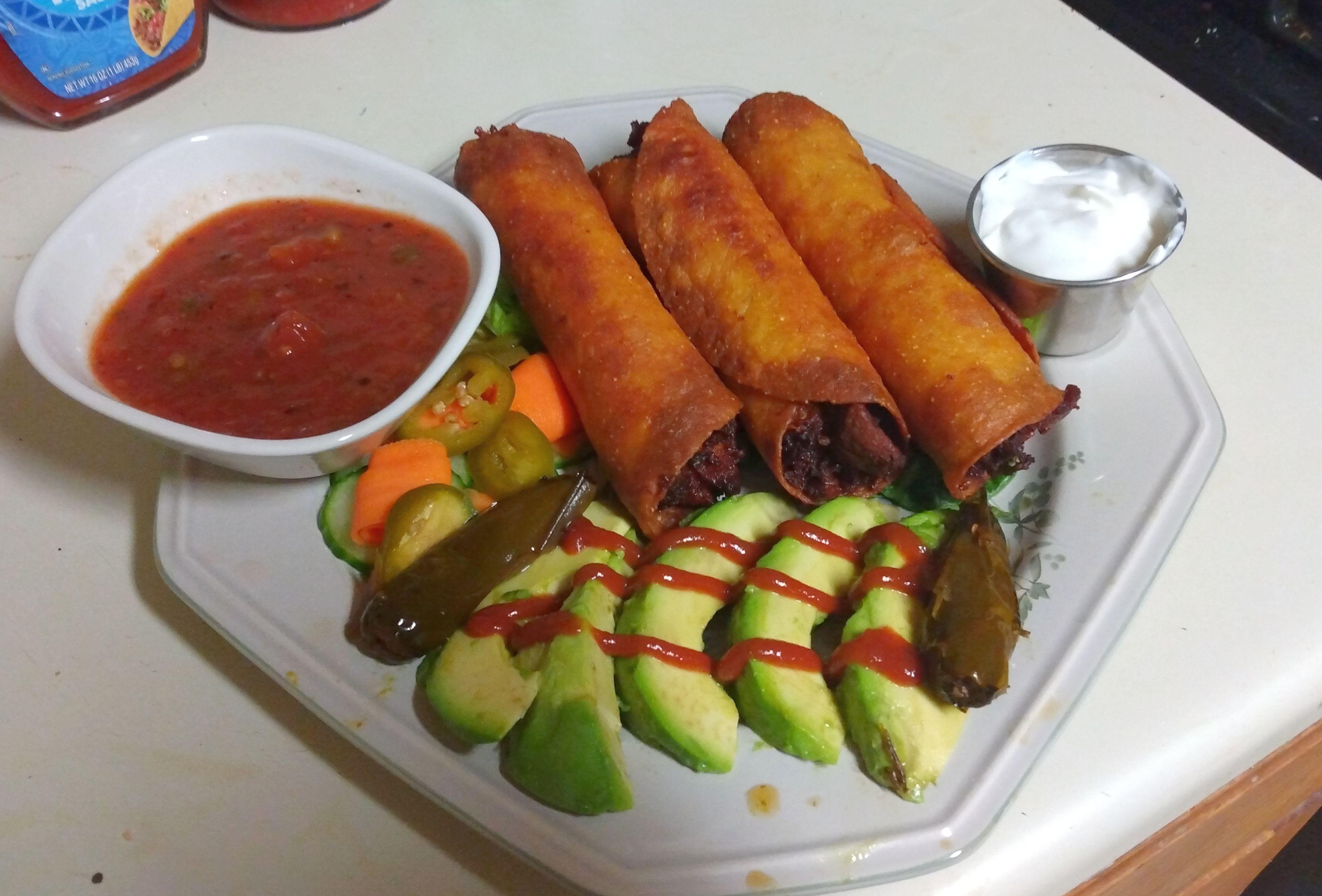 Taquitos Grande Chicken, cheese, roasted green chiles and onions