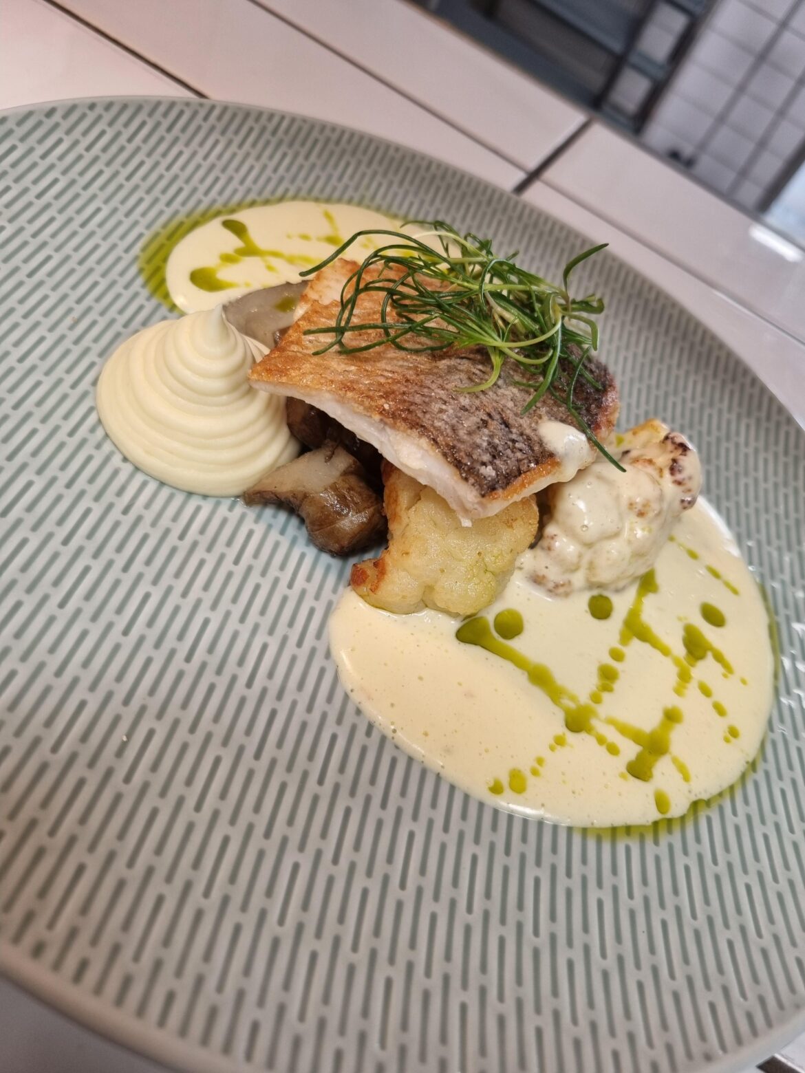 Pan seared whitefish, cauliflower puree, miso roasted cauliflower, Jerusalem artichokes, Beurre blanc and leek oil.