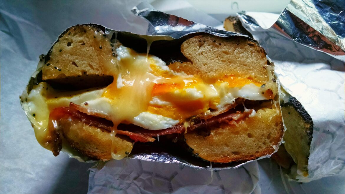Bacon, Egg, and Cheddar on a Poppy Seed Bagel (Black Seed Bagel, NYC)