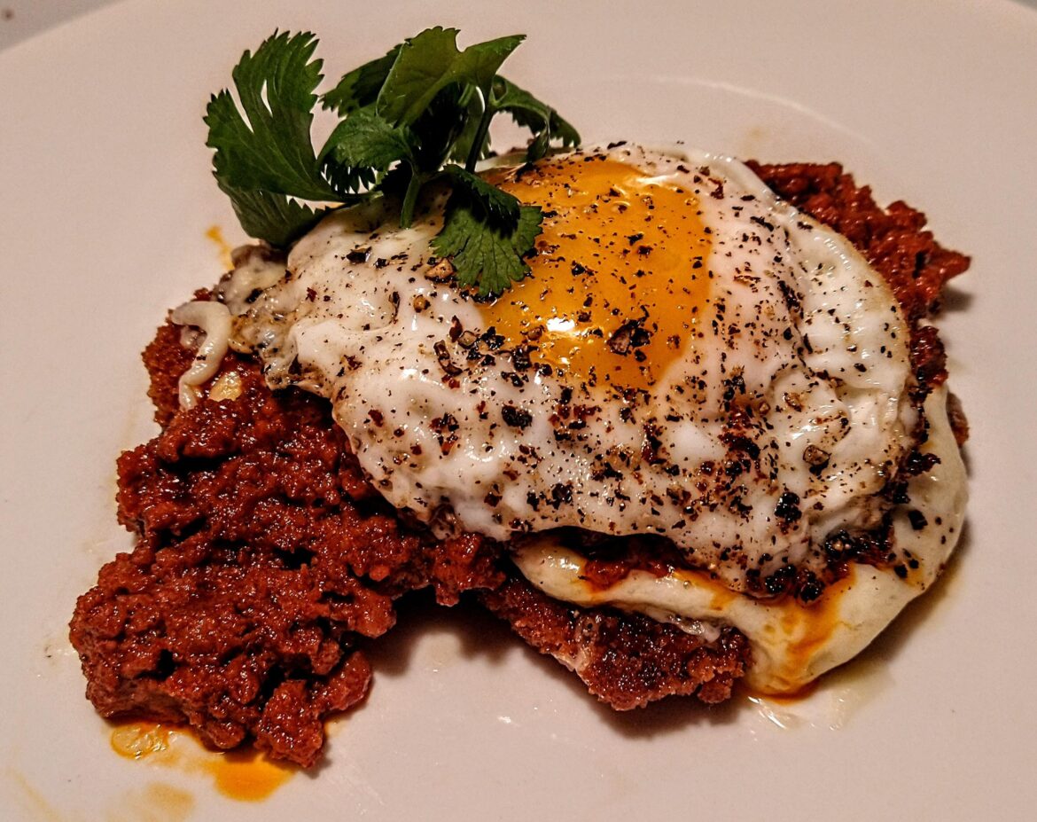 A solid add to any Sunday Brunch Menu. Thin Sliced Panko Crusted Pork Loin Chop with Melted Pepper Jack Cheese and Chorizo. Topped off with a Sunnyside Up Egg and Cilantro.
