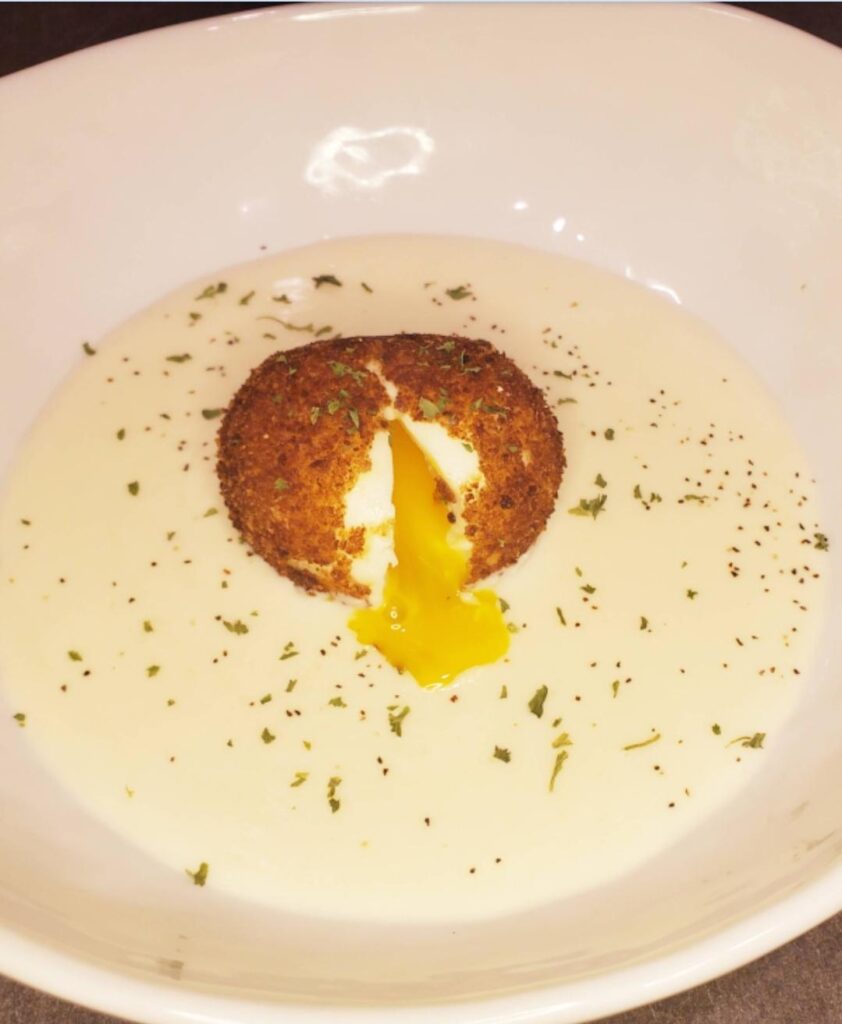 Deep fried egg on pecorino fondue