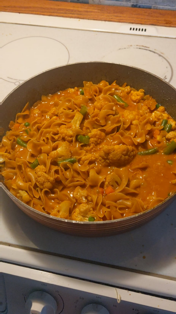Fire Roasted Coconut Curry with added egg noodles and some veggies! Delicious. Bread not in shot.