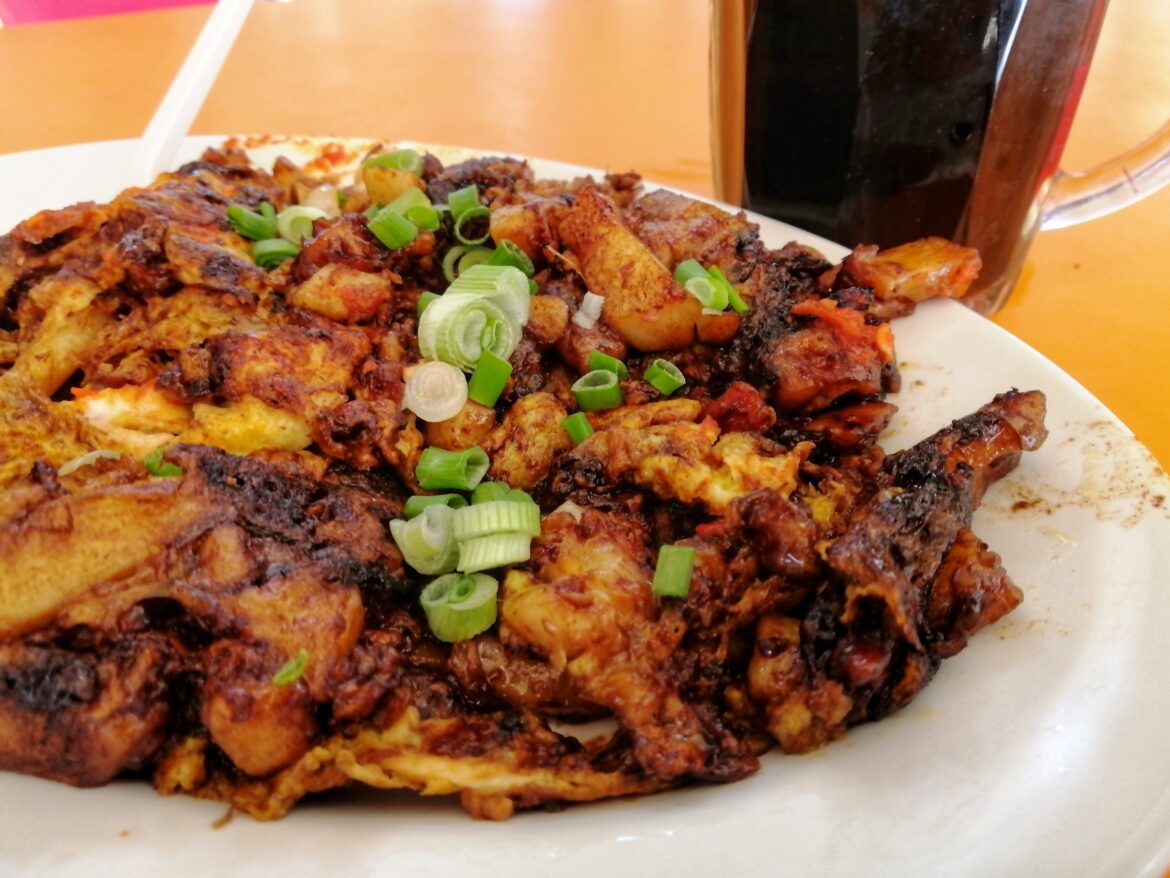 Singapore/Malaysia style fried carrot cake. Slabs of mashed radish and rice flour fried to perfection with eggs, sweet sauce & chilli!