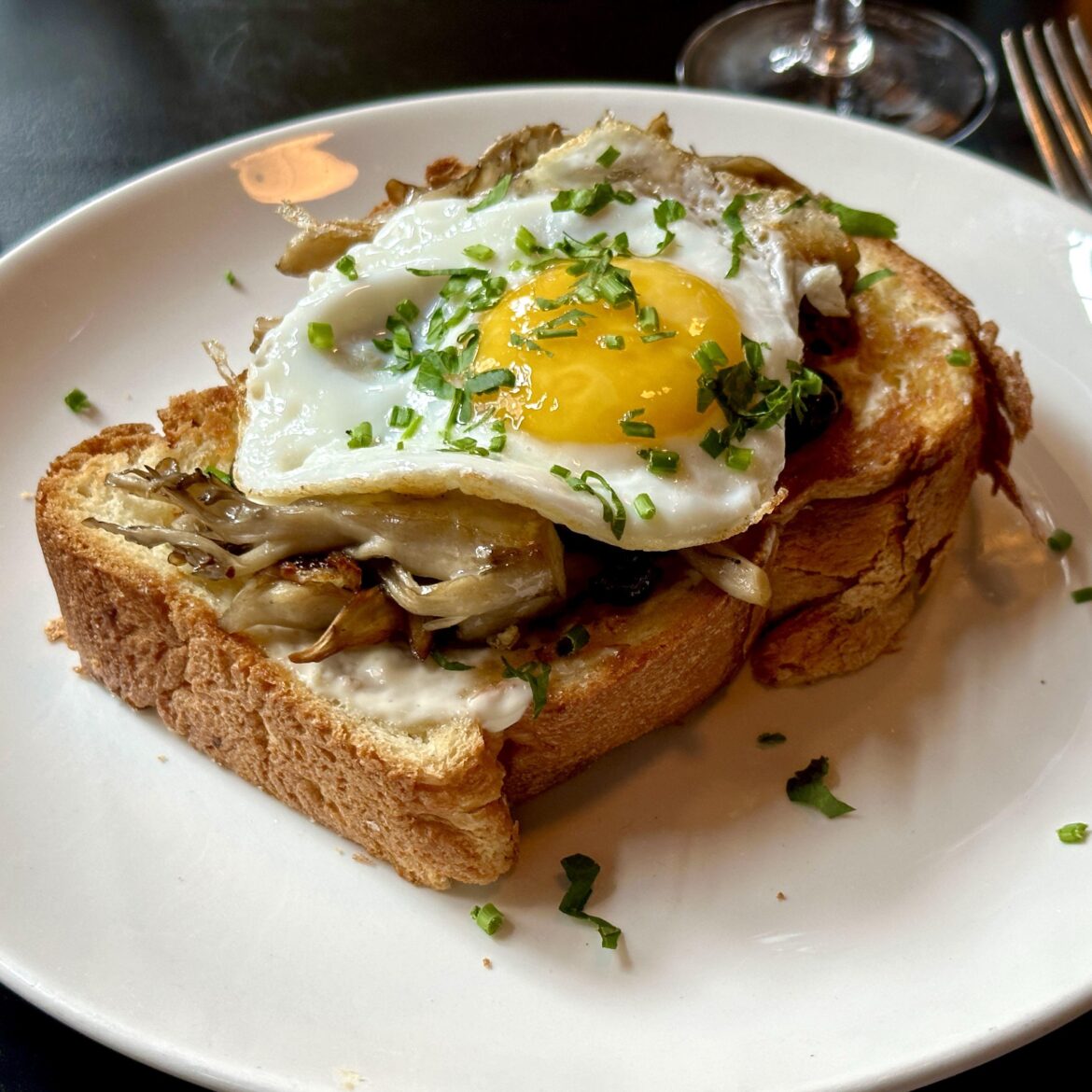 Wild mushrooms on brioche topped with a sunny-side up egg