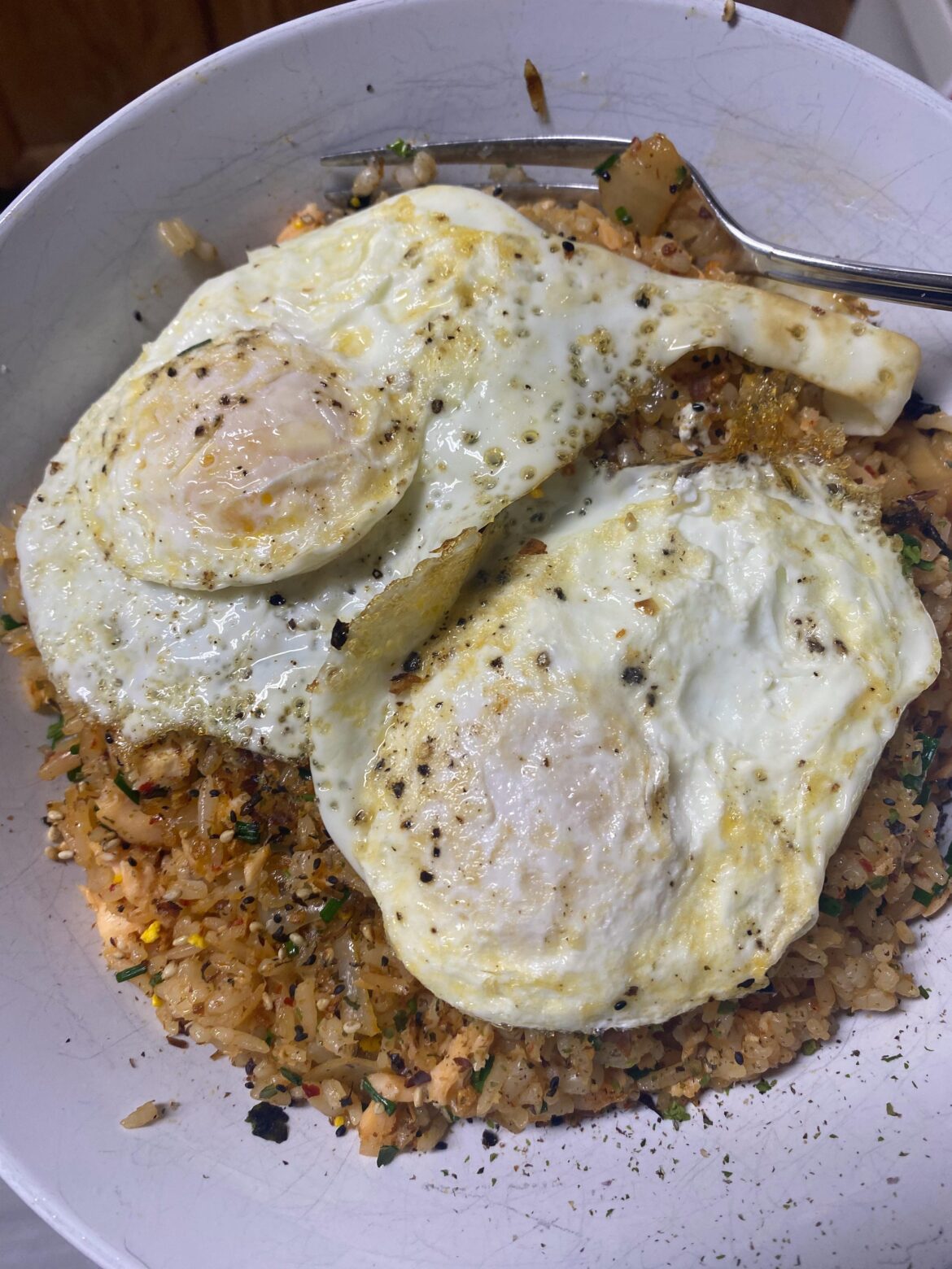 Kimchi and salmon fried rice with lots of onions, chives, and furikake. Topped with two fried eggs!