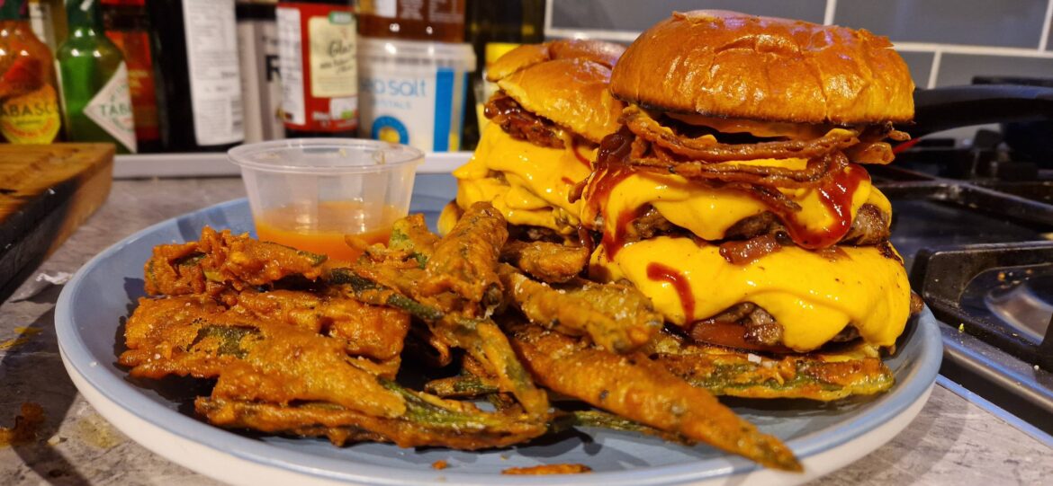 Double smash burgers with homemade onion rings, barbecue sauce and beer-battered okra with a mango-habanero dipping sauce as a side