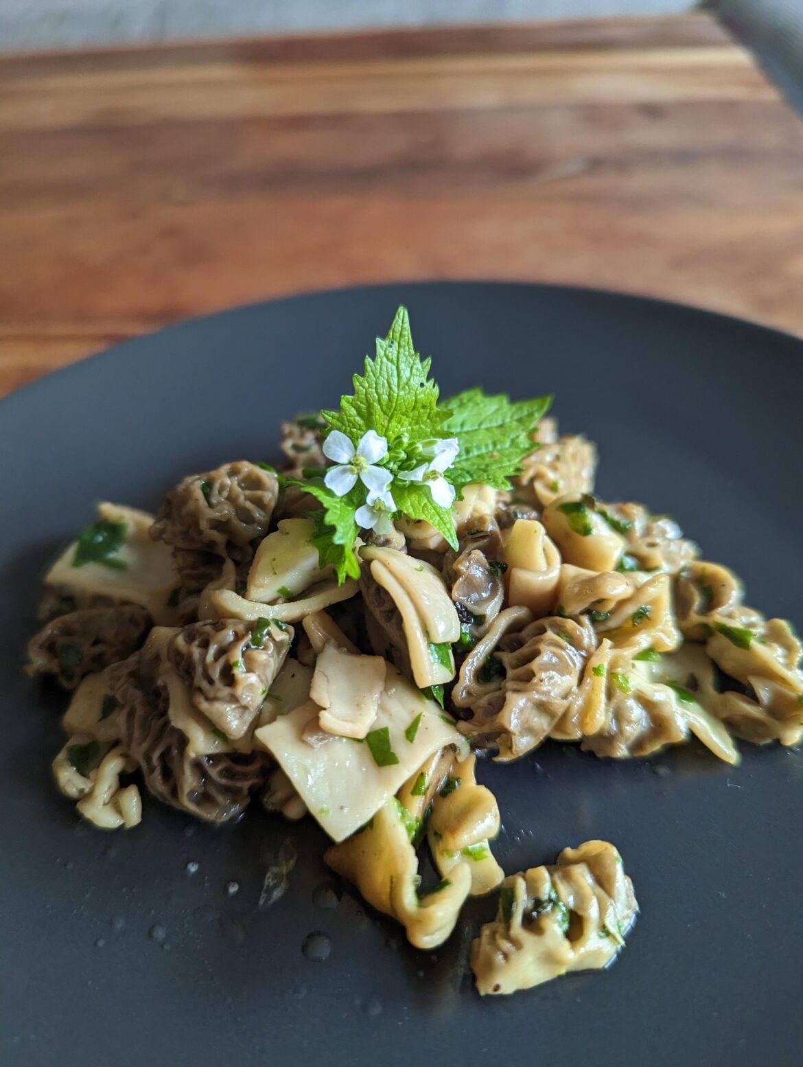 Buttered morels with wild garlic and garlic mustard (morels and herbs all collected by me in the wild)